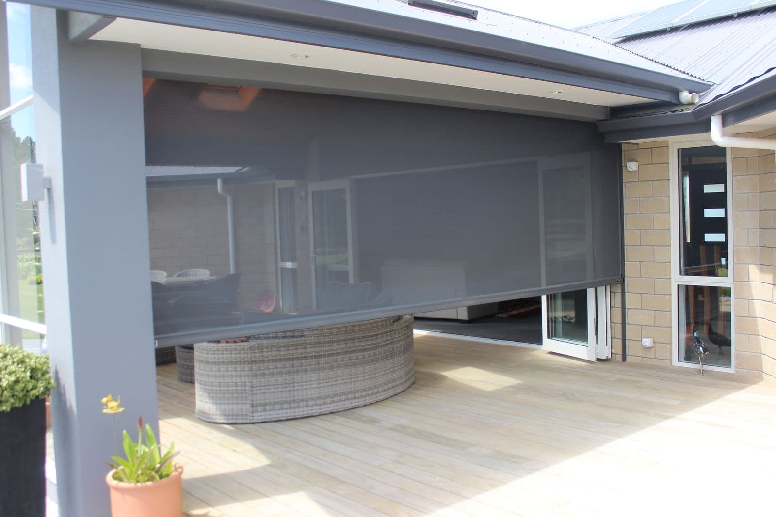Ziptrak blinds sheltering a deck with a spa pool
