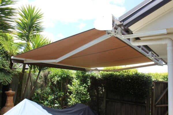 Retractable awning fitted above the deck of a family home