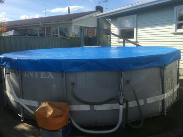 Custom cover protecting outdoor furniture from the weather