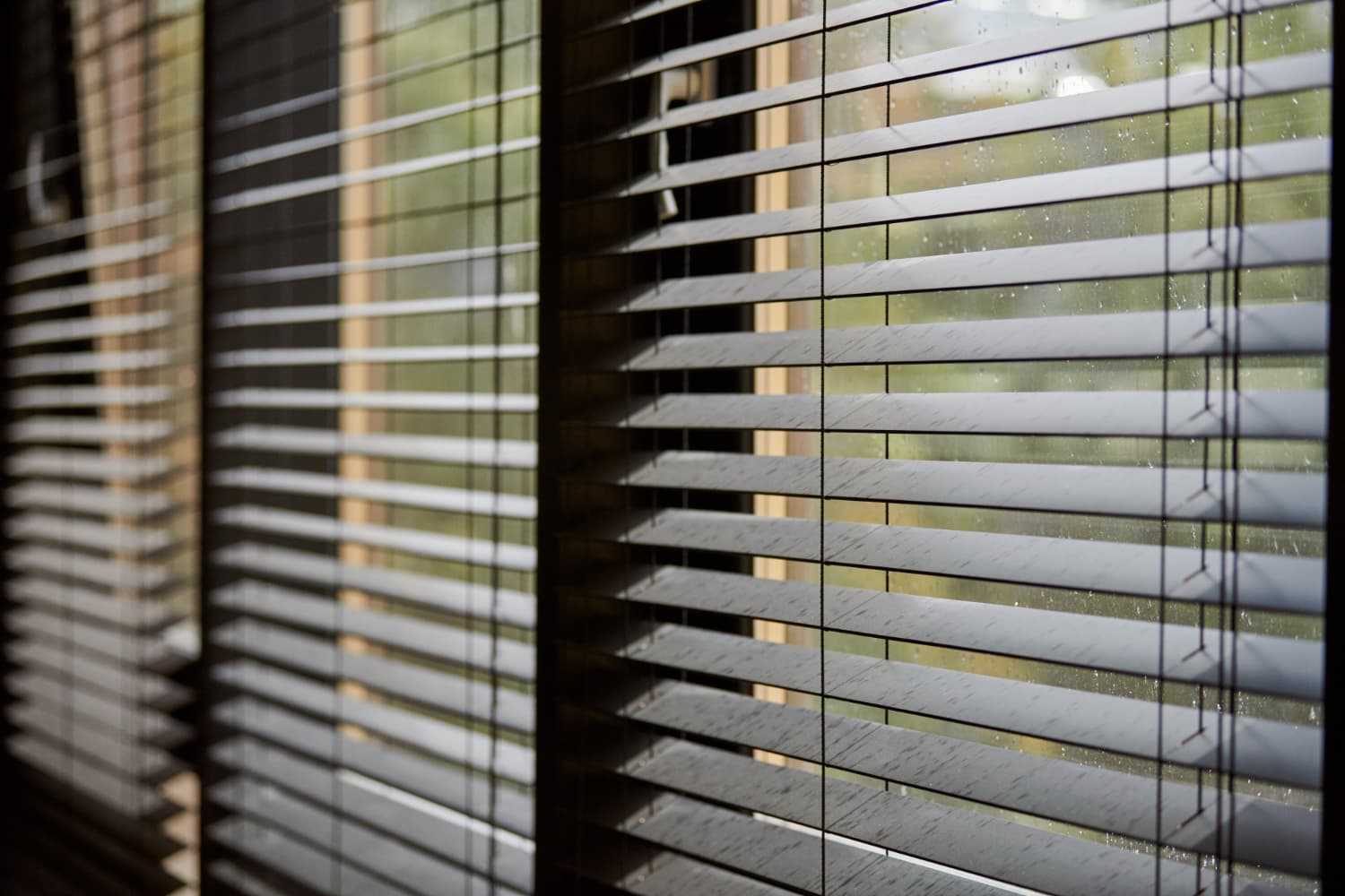 Modern wooden venetian blinds filtering light into a meeting room
