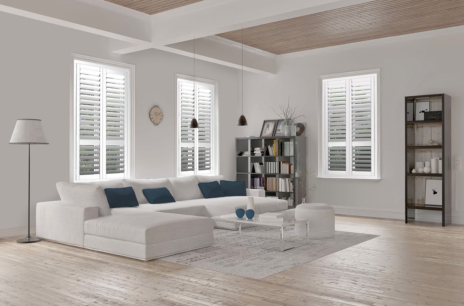 White interior window shutters installed in a bright lounge