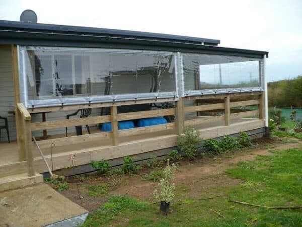Cafe blinds lowered over an outdoor seating area