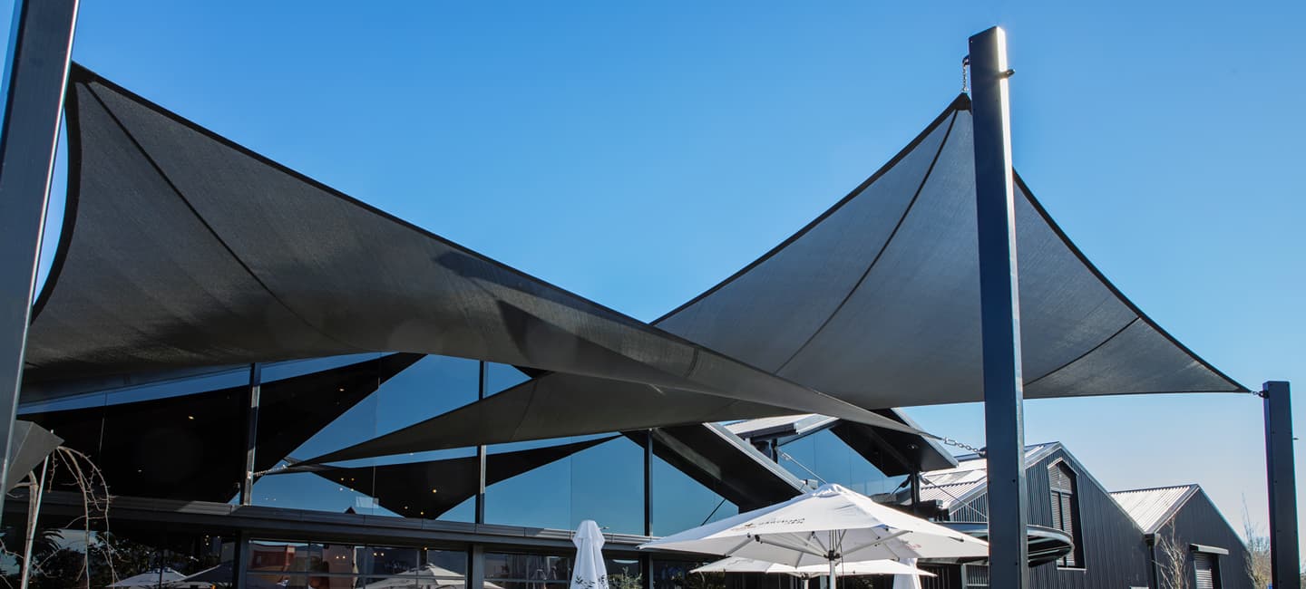 Kool Series Shadetex ready-made shade sail installed over a residential outdoor area