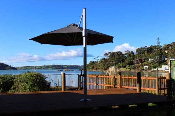 Shade7 outdoor umbrella in a landscaped garden setting