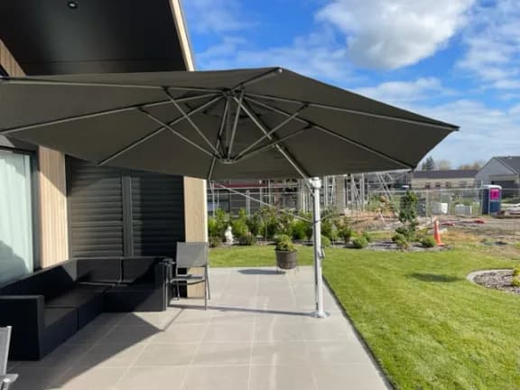 Shade7 umbrella providing shade over outdoor furniture