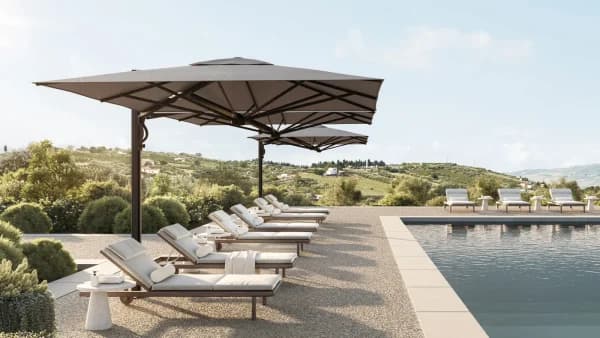 Shade7 Galaxy Dual multi-canopy umbrella over an outdoor cafe setting