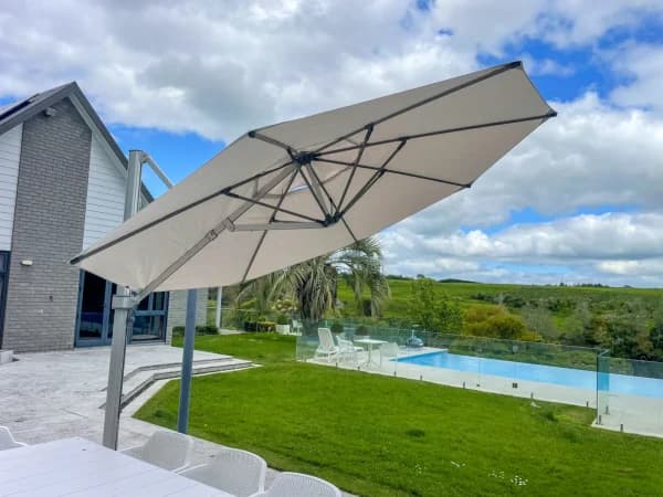 Shade7 umbrella with charcoal canopy on a patio