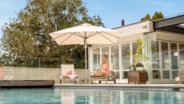 White square Shade7 Milan outdoor umbrella at a residence