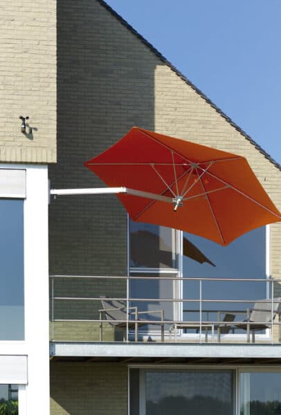 Red Shade7 Paraflex umbrella shading a domestic patio