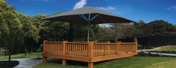 Shade7 Tempest LED umbrella glowing with integrated lights at night