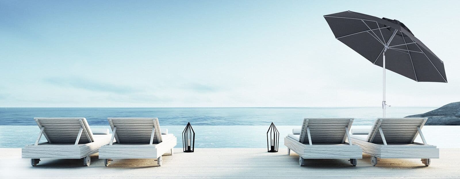 Tilting charcoal grey Shade7 Venice Tilt umbrella over seaside loungers