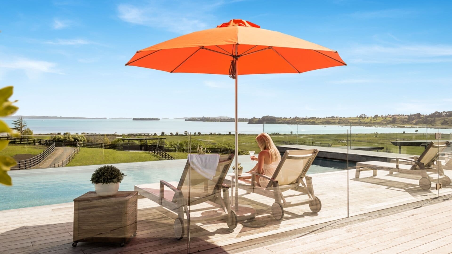 Orange Shade7 Venice fibreglass umbrella shading poolside loungers