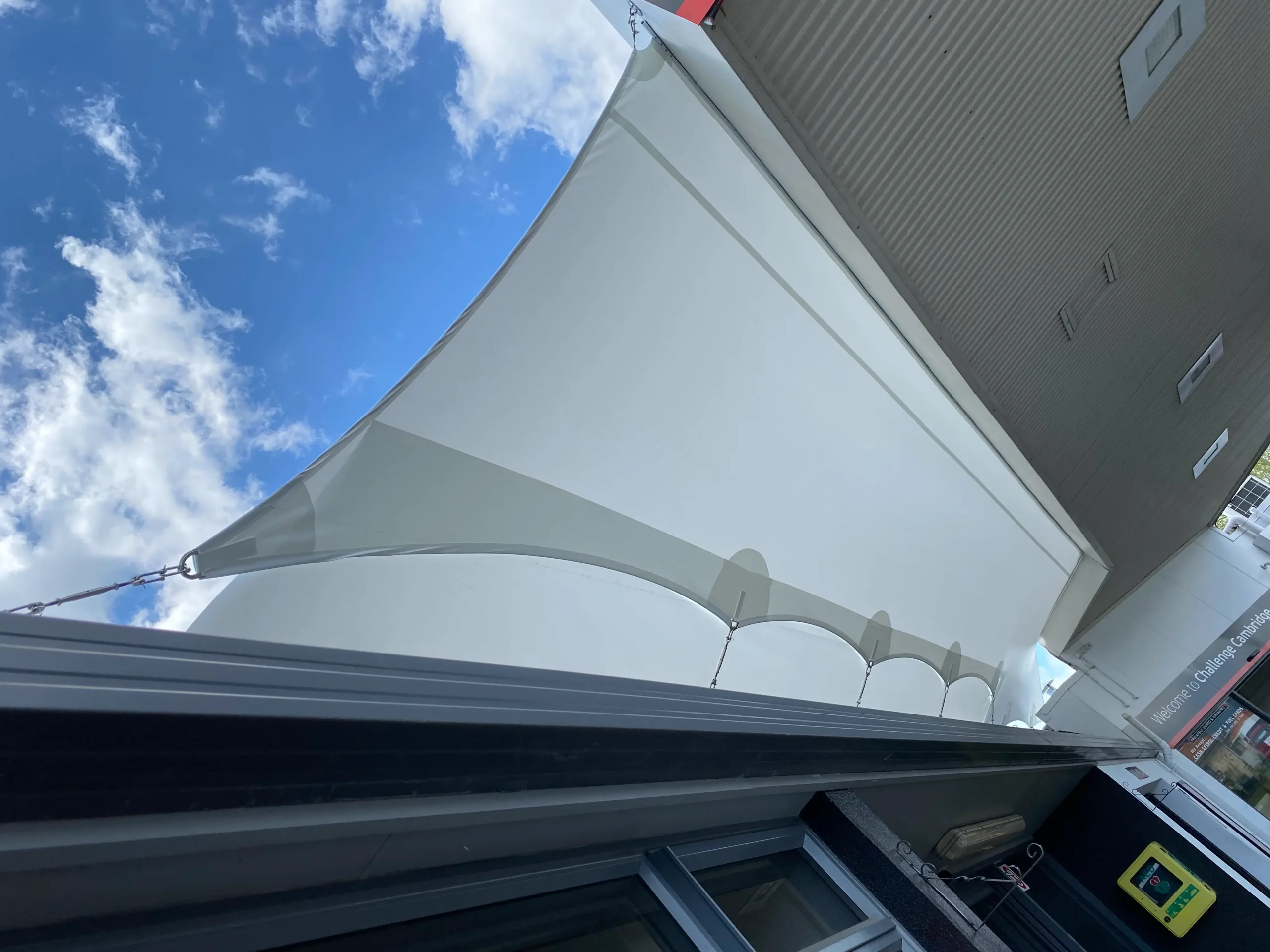 Waterproof sail over an outdoor dining area