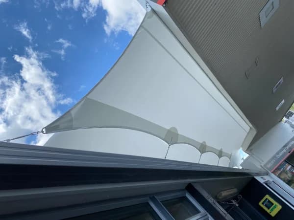 Waterproof PVC sail providing all-weather cover for a deck
