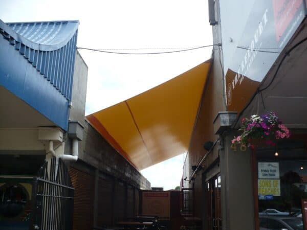 Waterproof sail shading an outdoor entertaining space