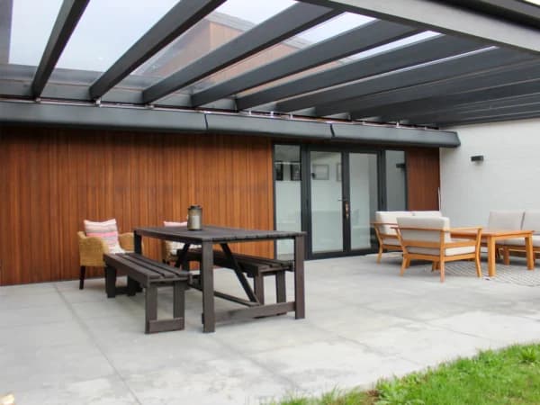 Wave shade canopy installed over an outdoor entertaining area