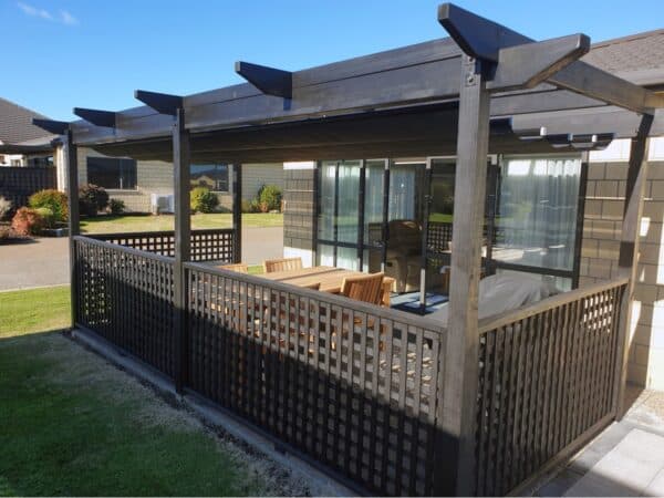 Wave shade sail fitted to a pergola structure