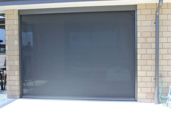 Lowered Ziptrak blinds creating an all-season outdoor room