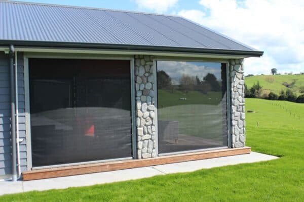 Track-guided Ziptrak blind lowered on a home veranda
