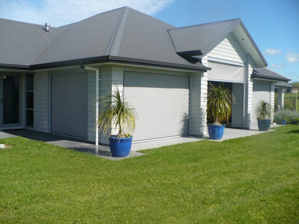 Ziptrak outdoor blinds beside a pool